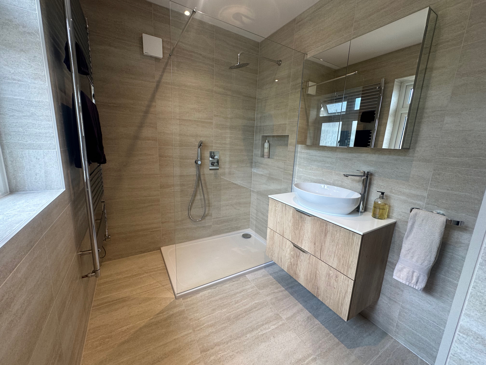 Contemporary Walk-In Shower, Crowhurst Contemporary bathroom with walk-in shower, floating vanity and stone-effect tiling