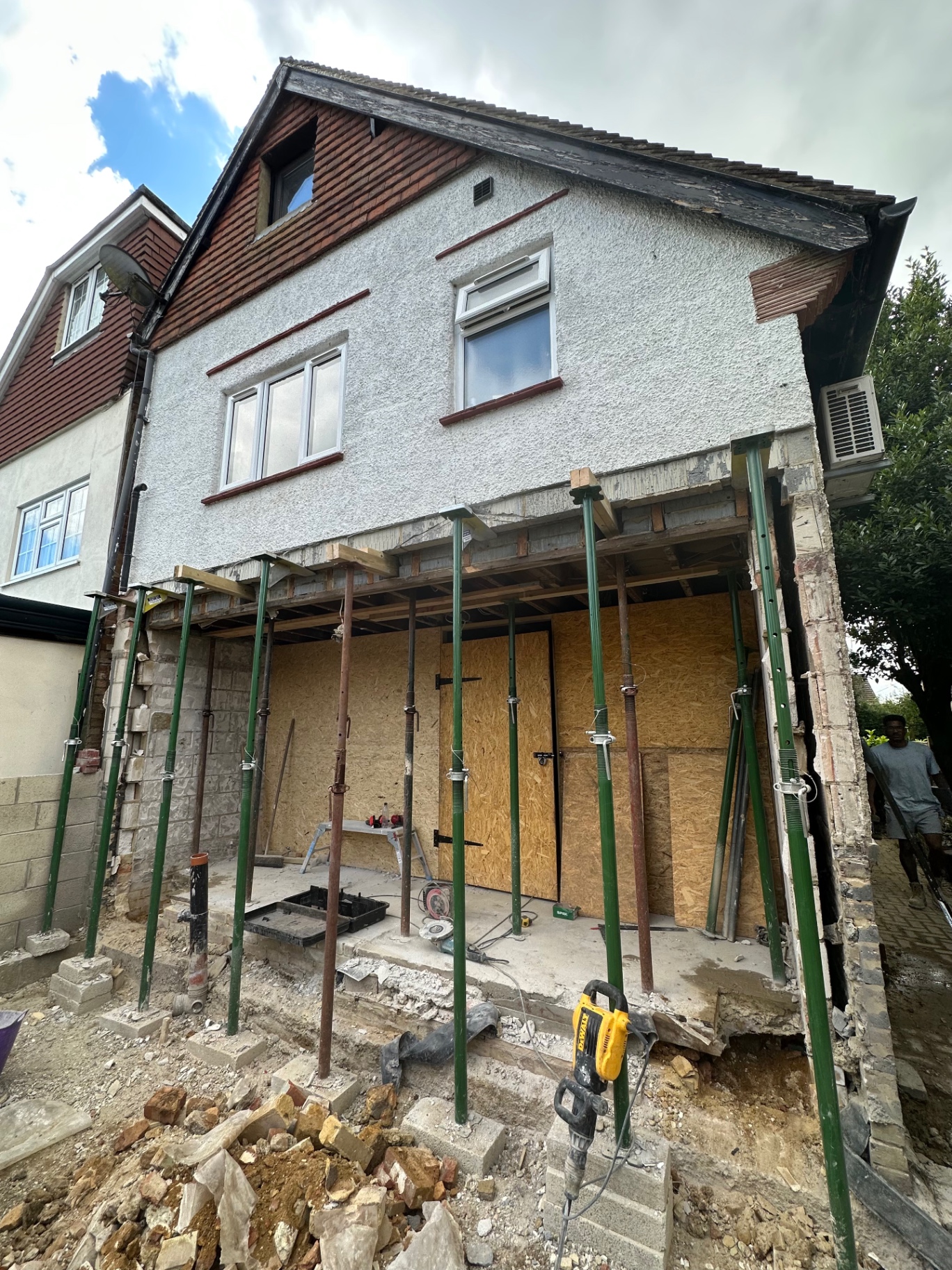 Rear wall opened up and propped as the new envelope takes shape