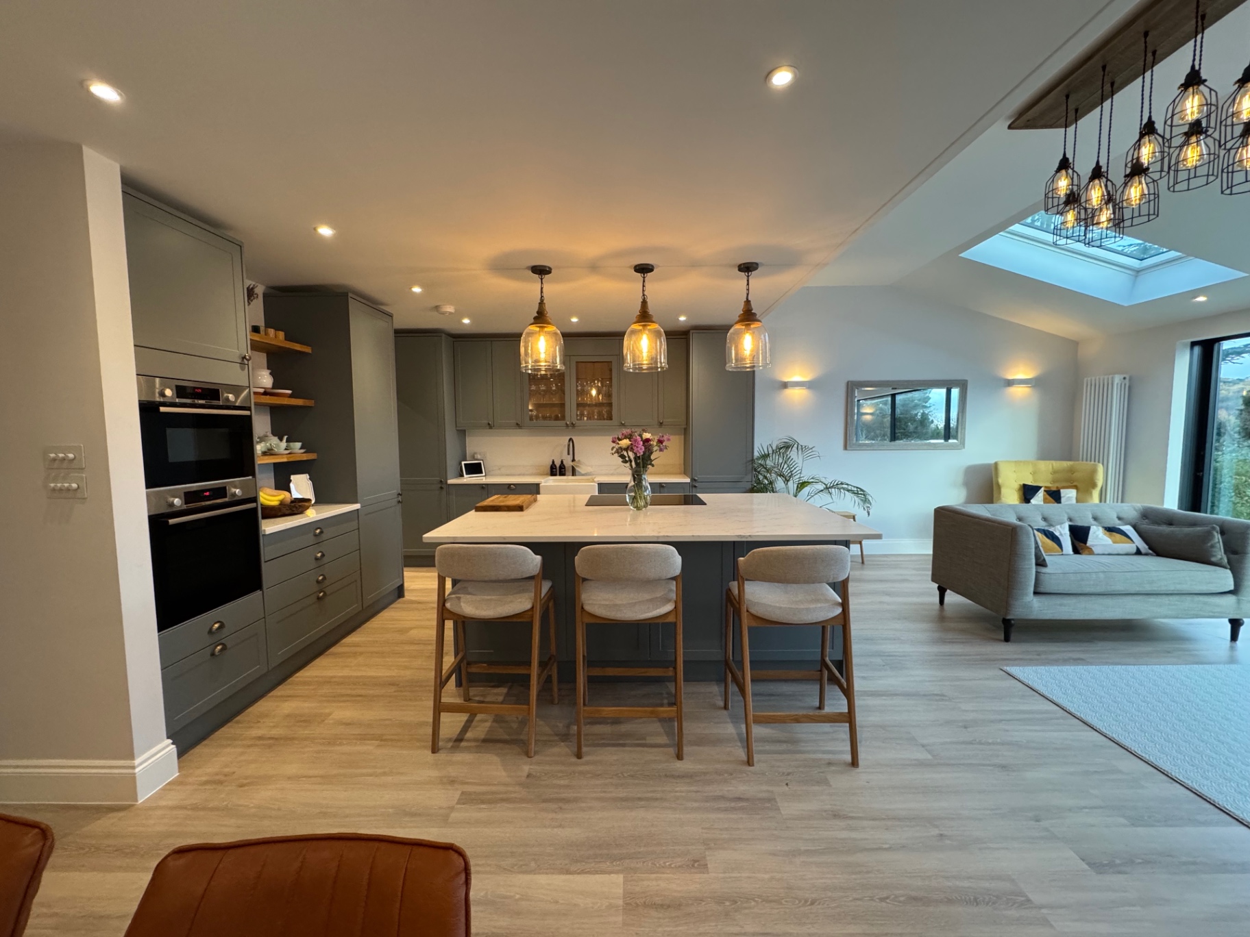 Wide view of the open-plan kitchen looking through to the family living area