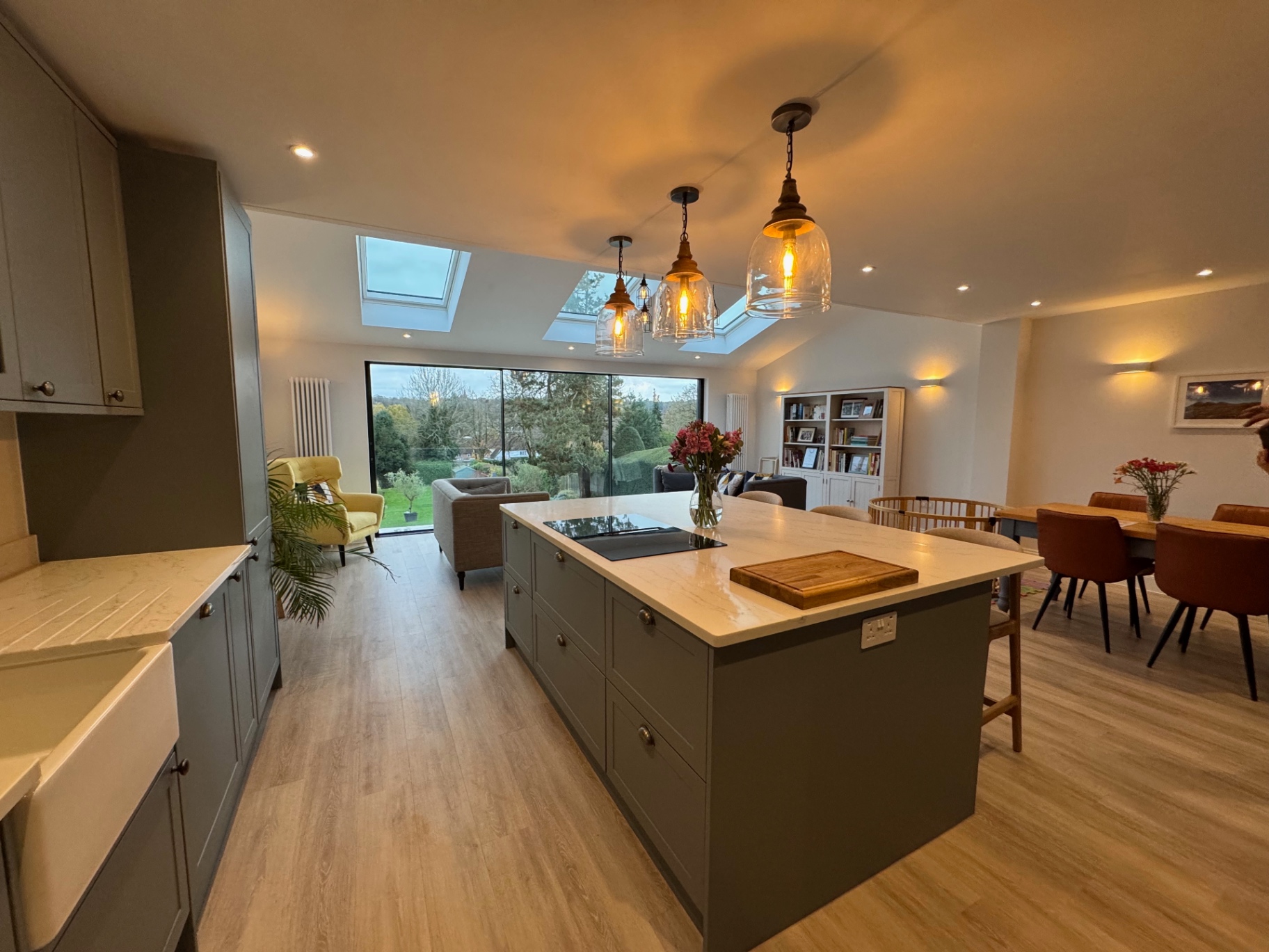 Full room view of the kitchen, dining and family space with rooflights