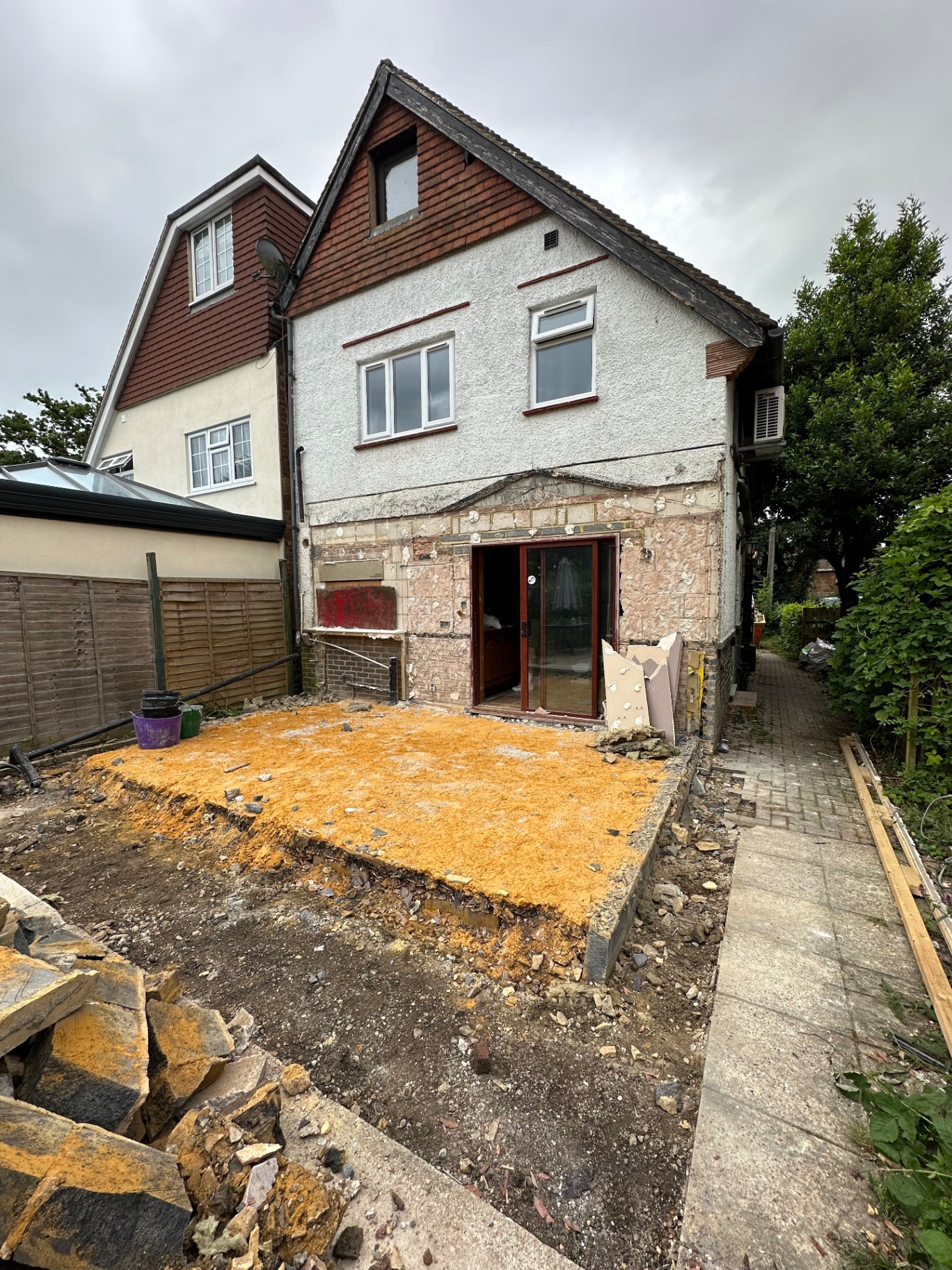 Rear of the property with the existing conservatory removed and ground prepared