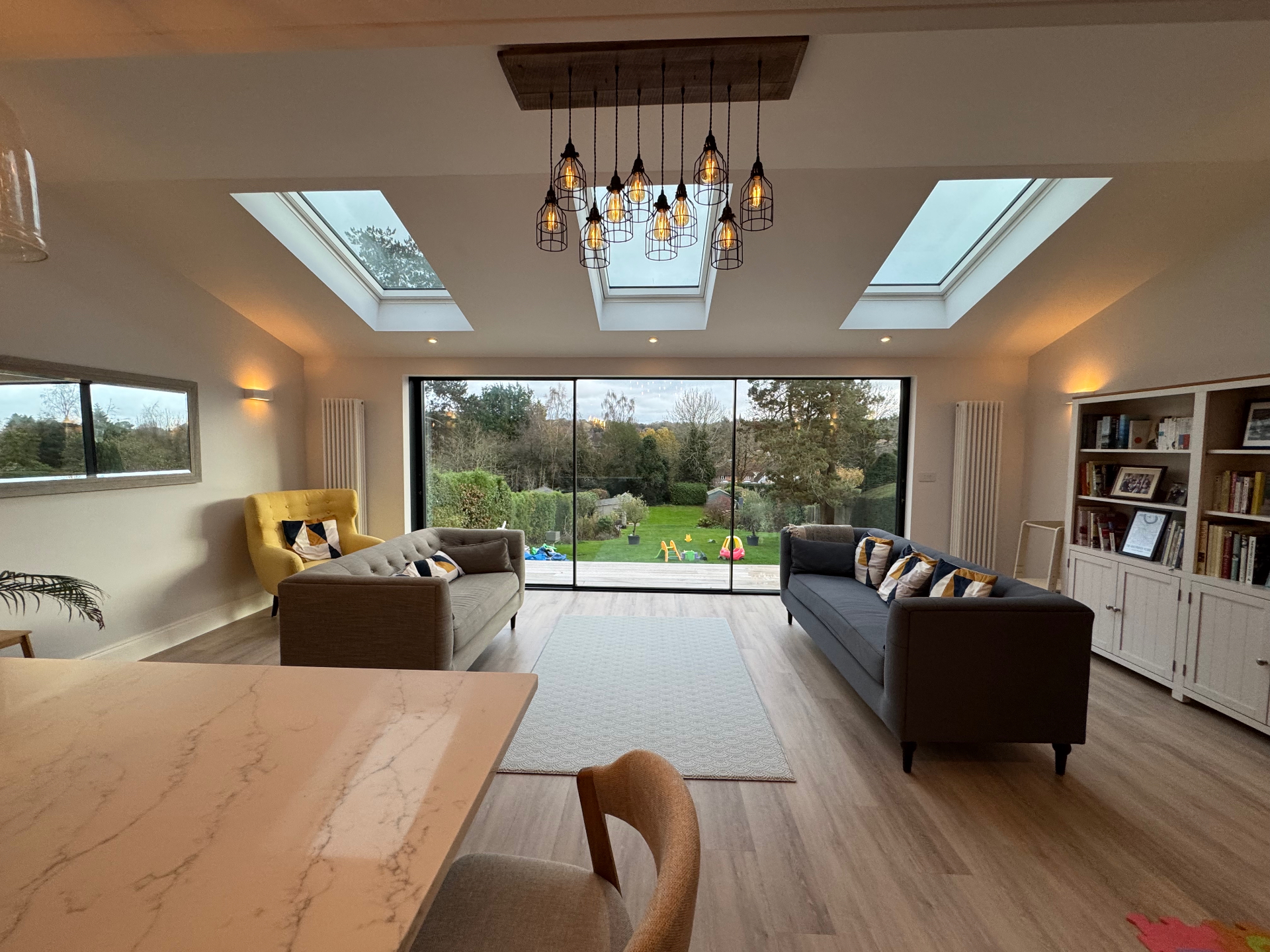 Living area with rooflights and large-format glazing to the garden